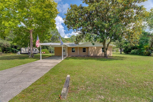 single story home with a front lawn and a carport