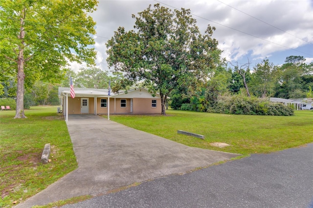 single story home with a front lawn and a carport