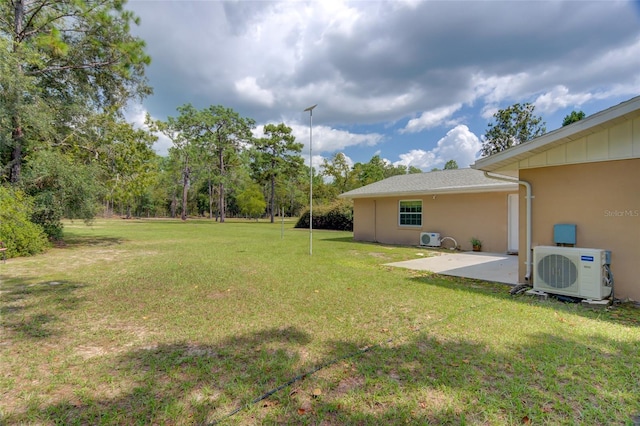 view of yard with a patio and ac unit