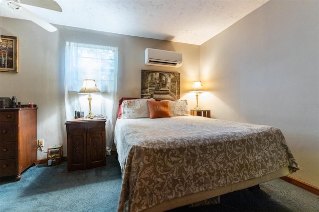 bedroom with ceiling fan, carpet floors, and a wall unit AC