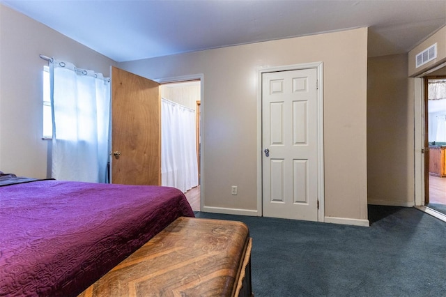 carpeted bedroom with a closet