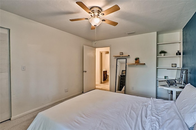 bedroom with ceiling fan and light carpet