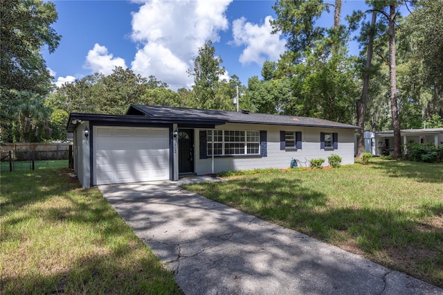 ranch-style home featuring a garage and a front yard