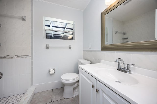 full bathroom with visible vents, toilet, a tile shower, vanity, and tile patterned flooring