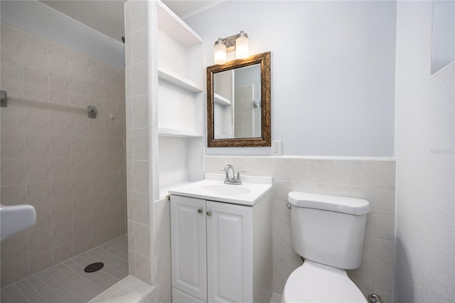 bathroom featuring backsplash, toilet, tile walls, tiled shower, and vanity