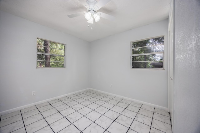 empty room featuring ceiling fan