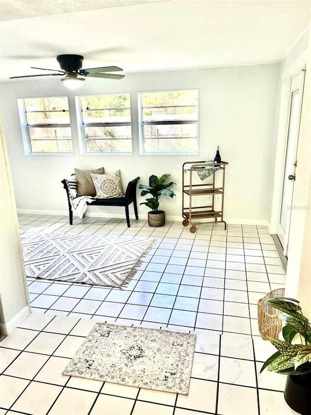 sunroom with a ceiling fan