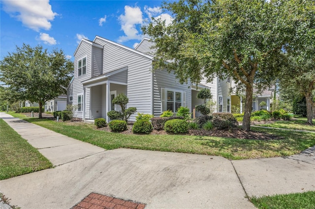 view of property exterior with a yard