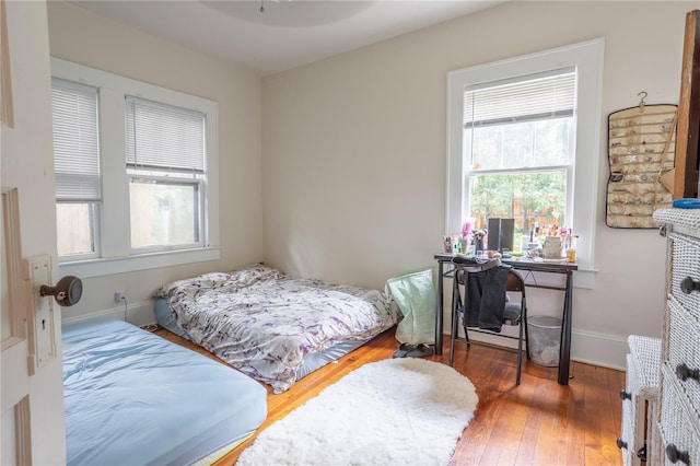 bedroom featuring dark hardwood / wood-style flooring