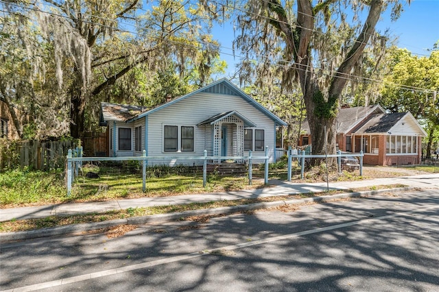 119 NW 11th St, Gainesville, FL 32601 - bungalow featuring a fenced front yard