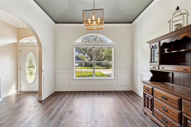 entryway featuring dark hardwood / wood-style floors and ornamental molding