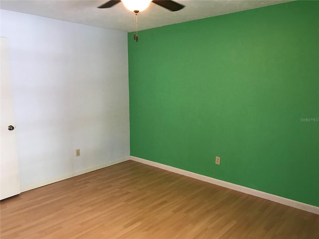 unfurnished room with wood-type flooring and ceiling fan