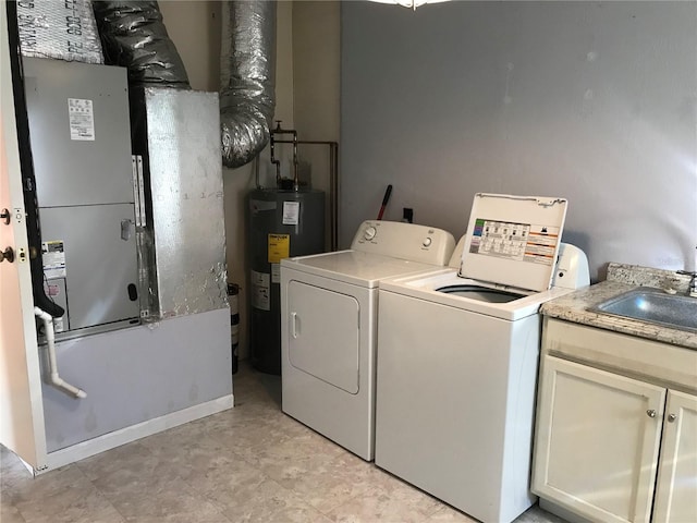 washroom featuring sink, cabinets, electric water heater, independent washer and dryer, and heating unit