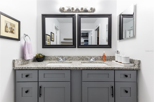 bathroom with double vanity and a sink