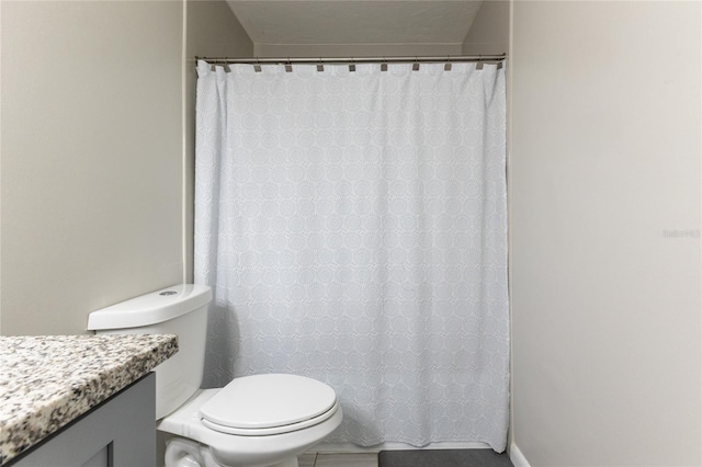 bathroom featuring vanity and toilet