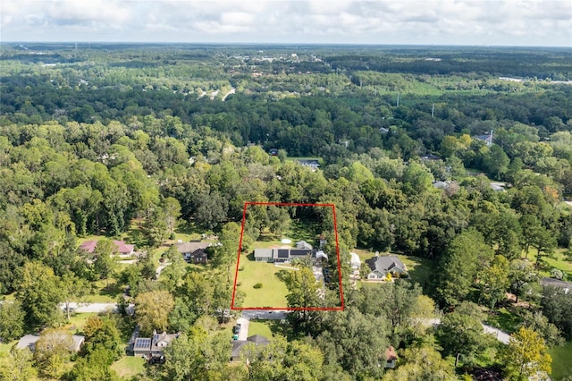 drone / aerial view featuring a forest view