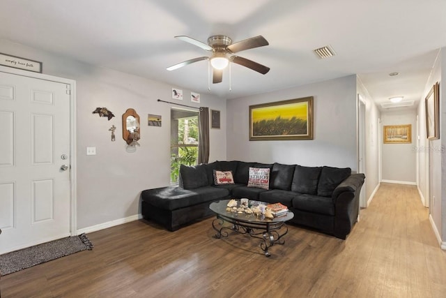 living room with hardwood / wood-style floors and ceiling fan