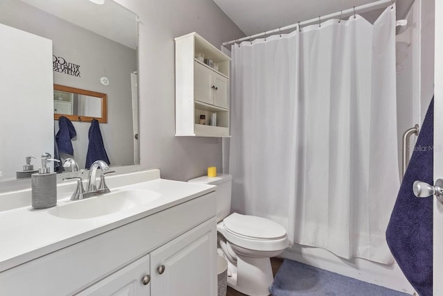 bathroom featuring toilet and vanity