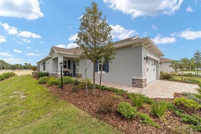 exterior space featuring a garage and a yard