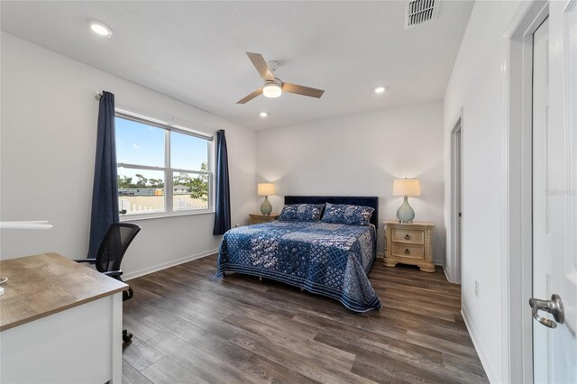 bedroom featuring dark hardwood / wood-style flooring and ceiling fan