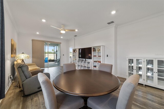 dining room with ceiling fan, hardwood / wood-style flooring, and ornamental molding