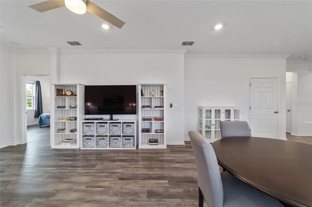 dining space with ceiling fan, crown molding, and dark hardwood / wood-style flooring