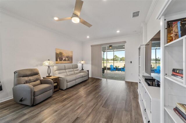 living room with ceiling fan, ornamental molding, and hardwood / wood-style floors