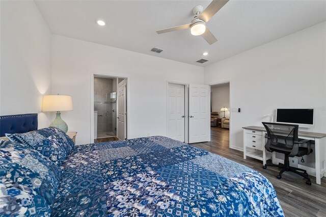 bedroom featuring dark hardwood / wood-style flooring, ceiling fan, and ensuite bathroom