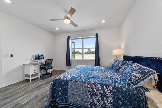 bedroom featuring ceiling fan and hardwood / wood-style flooring