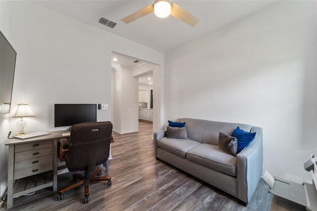 office with ceiling fan and dark hardwood / wood-style floors