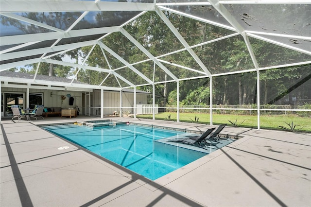 view of pool featuring a lawn, a lanai, and a patio