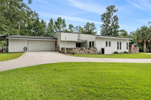 view of front facade with a front yard and a garage