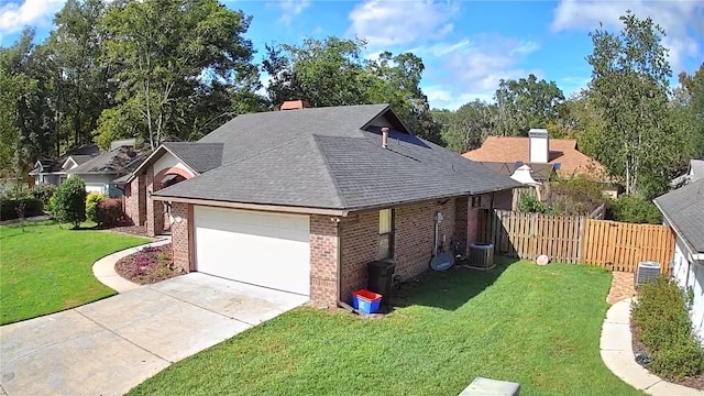 view of front facade with a front yard and a garage