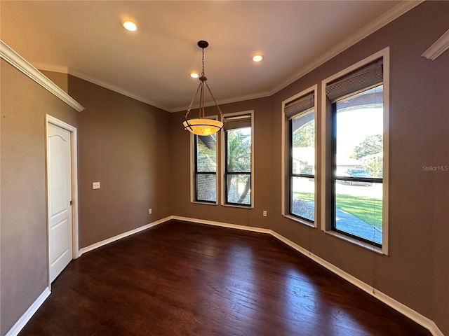 empty room with dark wood-type flooring and crown molding