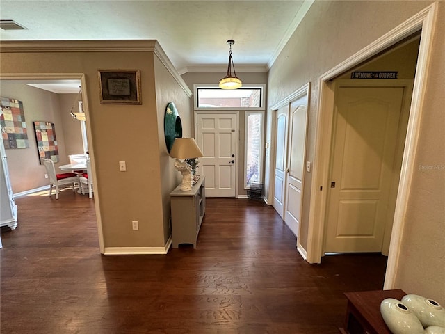 entryway featuring ornamental molding and dark wood-type flooring