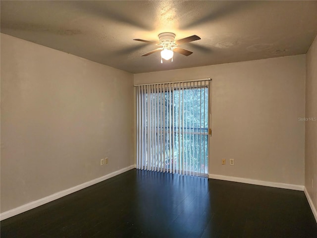 unfurnished room with ceiling fan, dark hardwood / wood-style flooring, and a textured ceiling