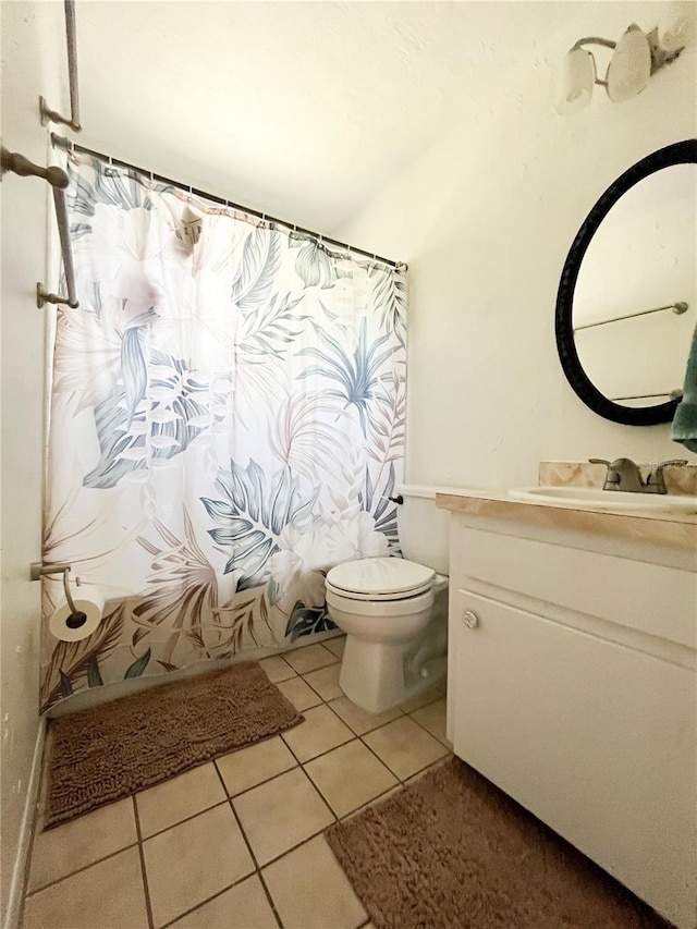 full bath featuring shower / tub combo, vanity, toilet, and tile patterned floors