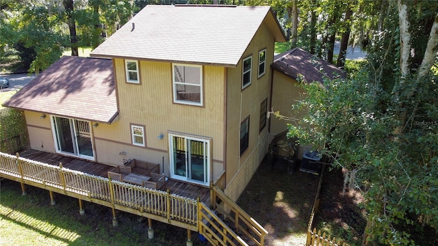 rear view of house featuring a deck