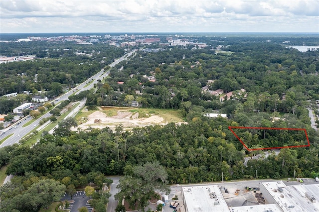 aerial view featuring a view of trees