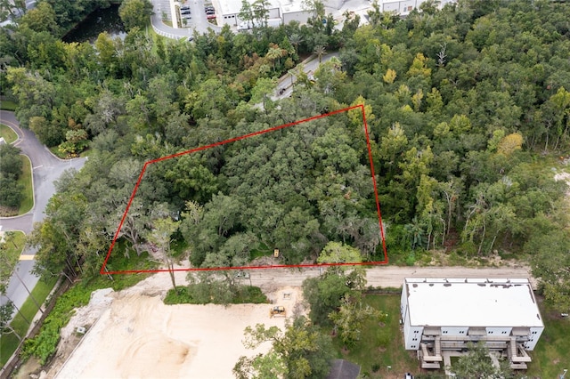 drone / aerial view with a view of trees