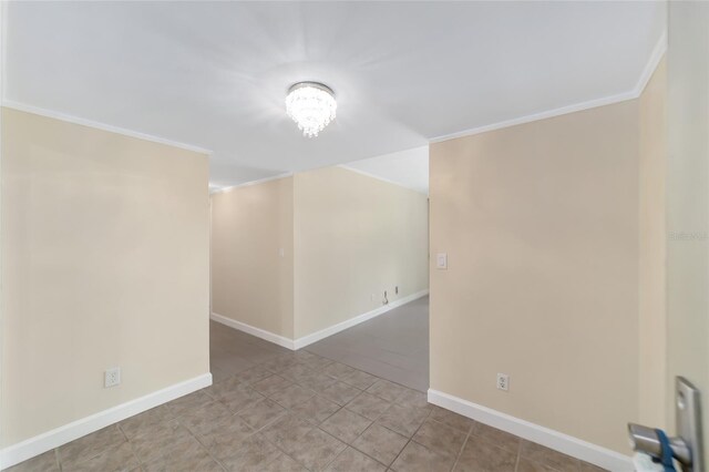 unfurnished room with ornamental molding