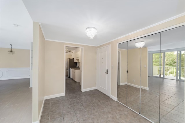 hallway with light tile patterned floors and crown molding