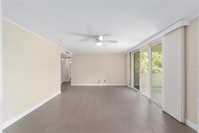 empty room featuring ornamental molding and ceiling fan