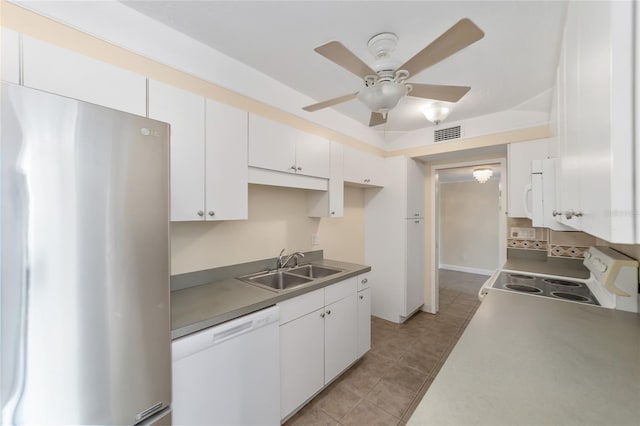 kitchen featuring ceiling fan, sink, white cabinets, and white appliances