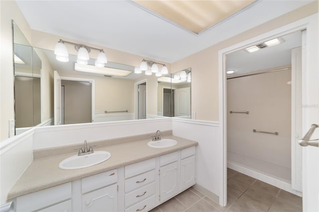 bathroom featuring tile patterned flooring and vanity