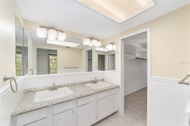 bathroom with vanity and tile patterned floors