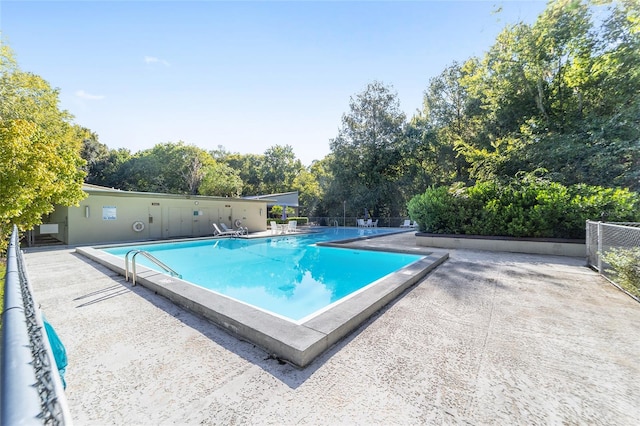 view of swimming pool featuring a patio area