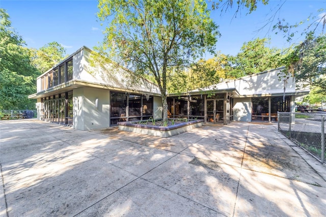 rear view of property featuring a patio