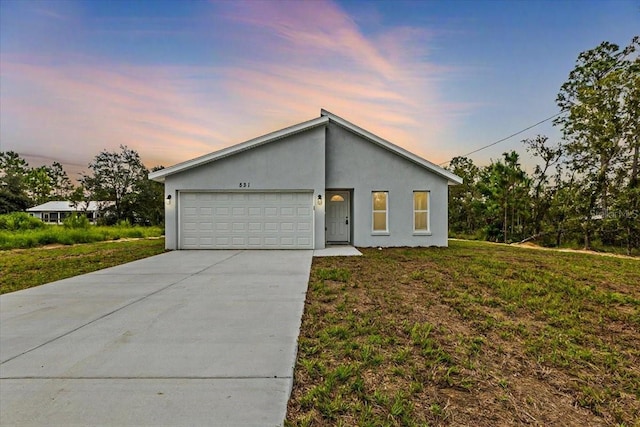 view of front of home with a yard