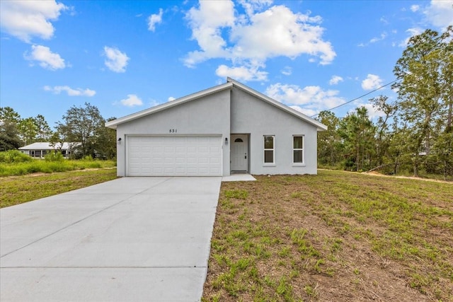 ranch-style home with a garage and a front yard